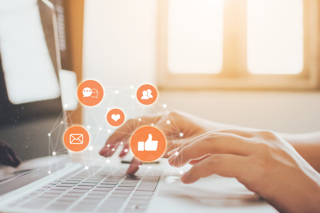 How You Can Build a Following on Social Media and Gain Trust. Hand of businessman using laptop with icon social media and social network.