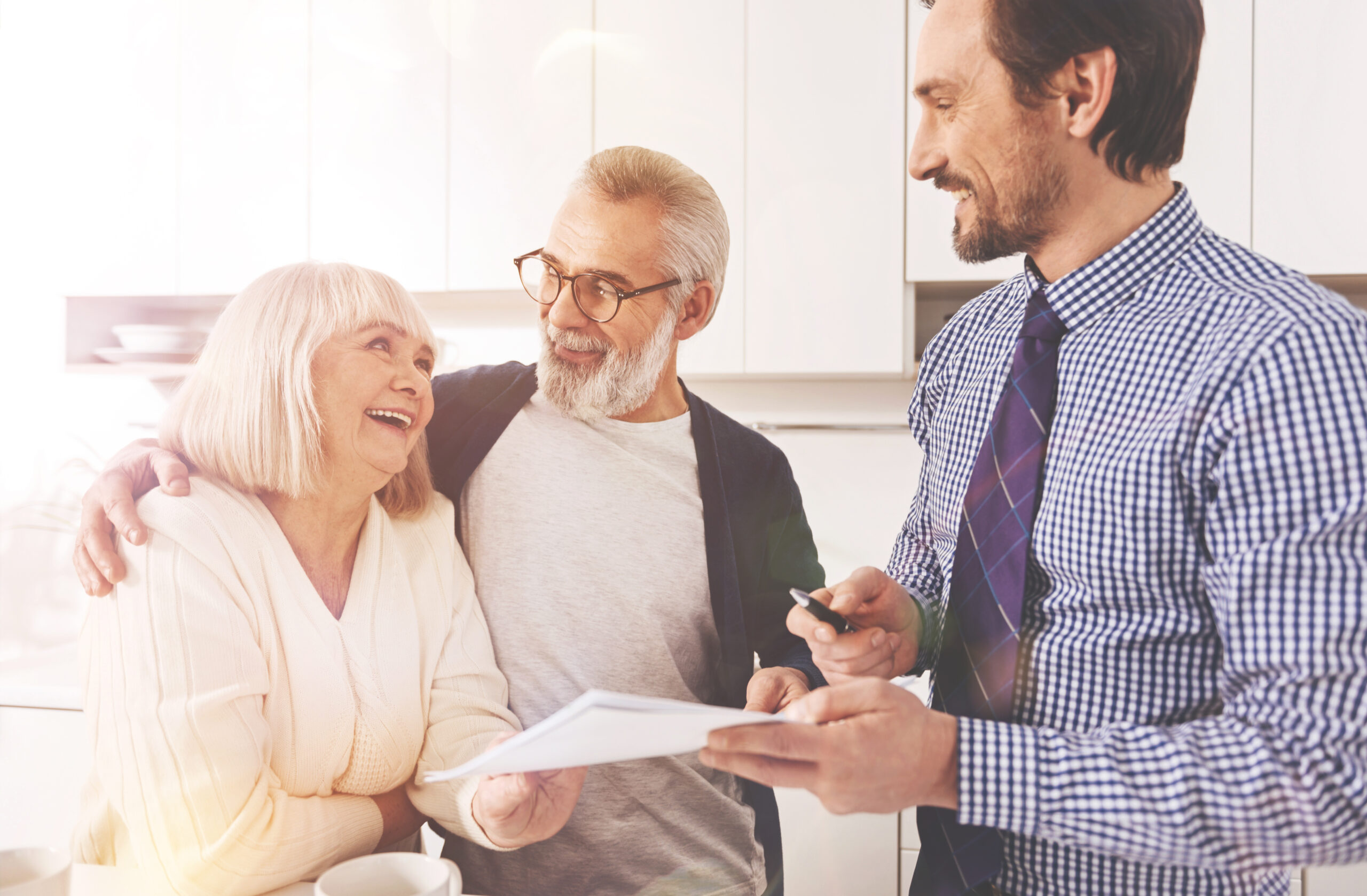 Joyful aged couple working with insurance agent