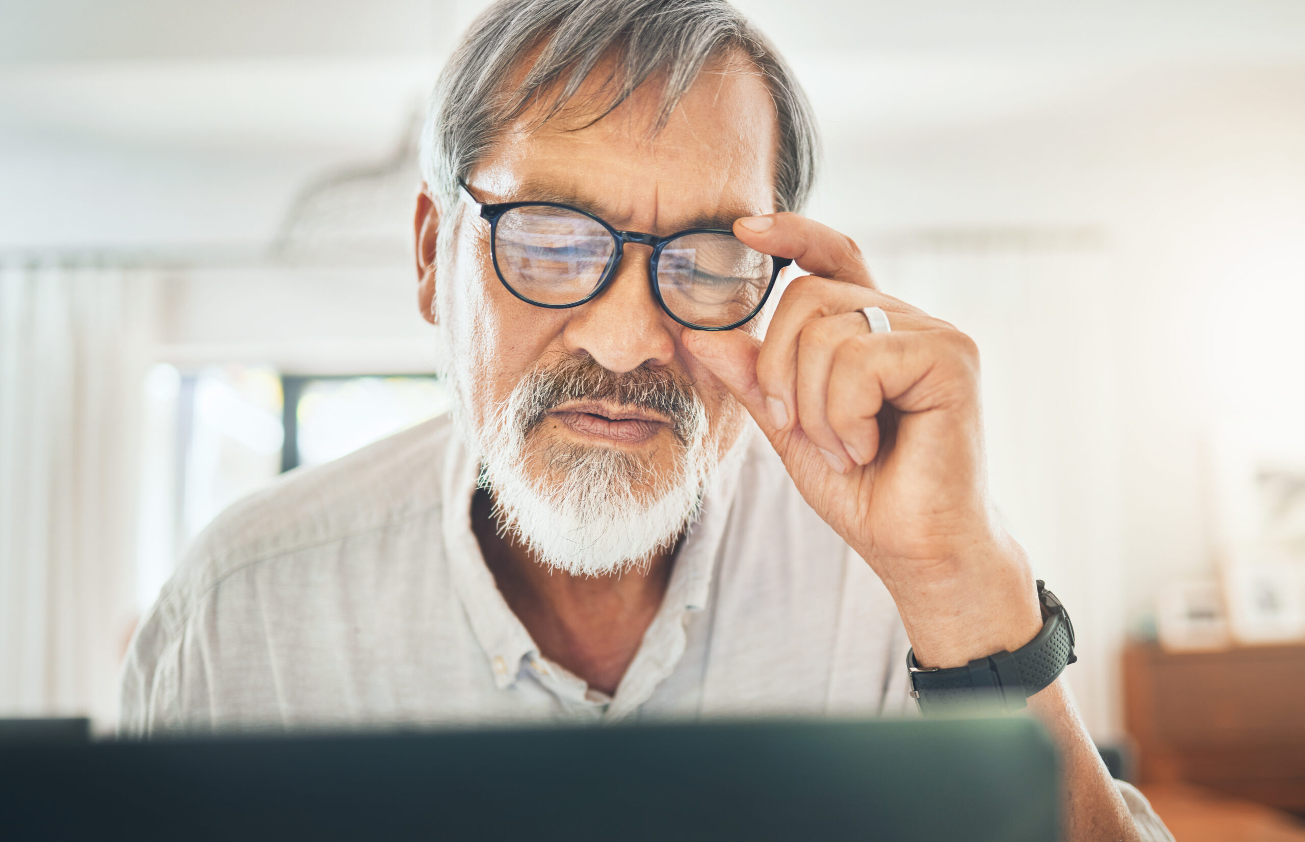 Senior man, glasses and headache on computer checking his email