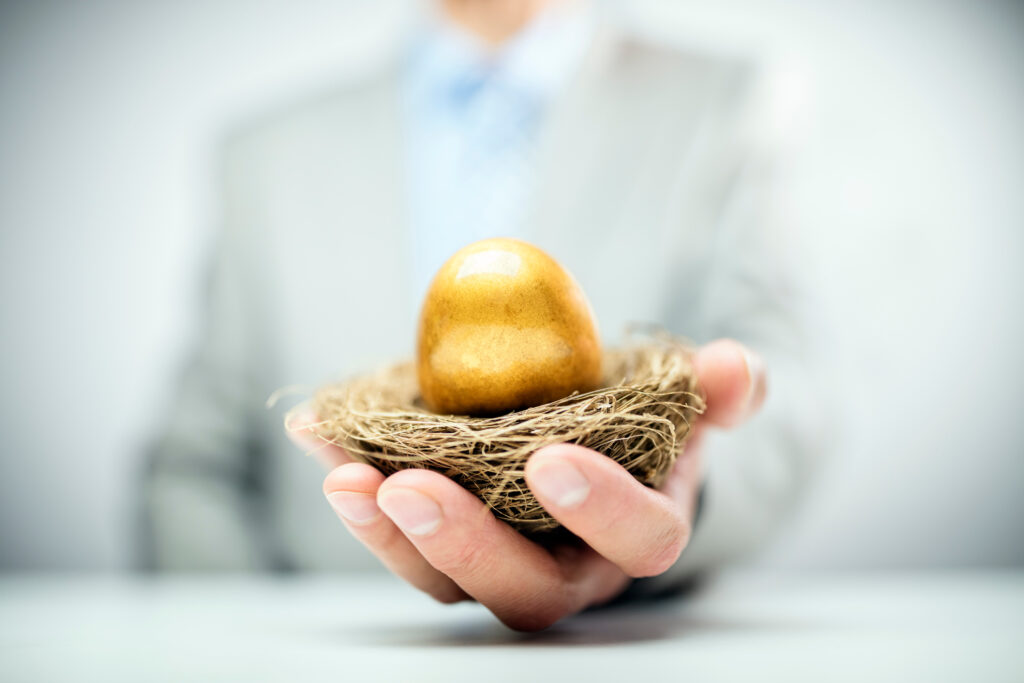 agent holding a golden nest egg preparing to help client protect their retirement income